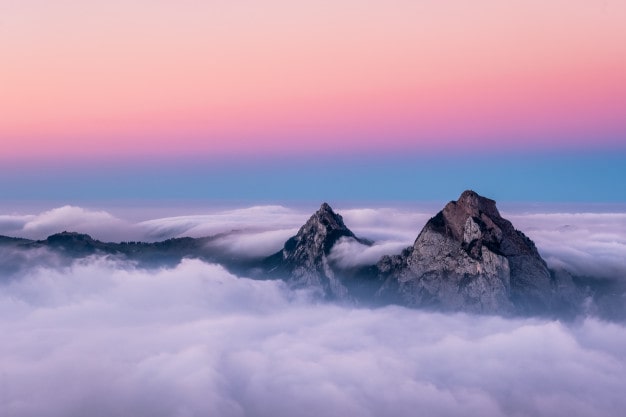 beautiful-aerial-shot-fronalpstock-mountains-switzerland-beautiful-pink-blue-sky_181624-9315-min